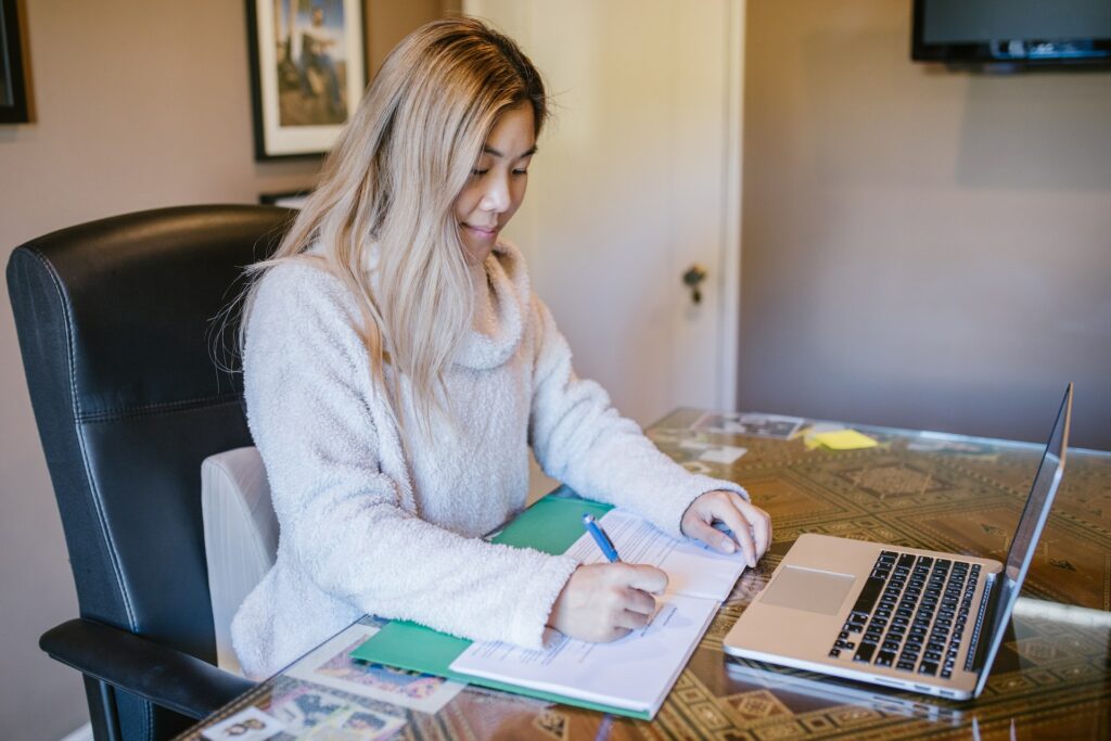 A female accountant signing documents