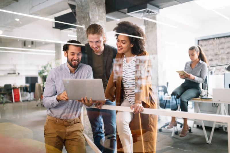 Team collaborating in a modern office, discussing the best accounts payable systems for efficient financial management and automation