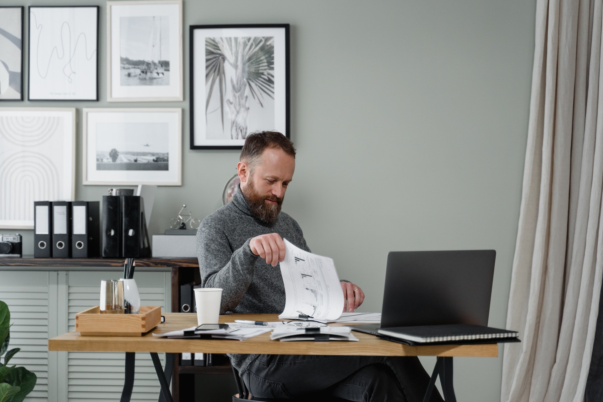 a man thinking at his desk about a