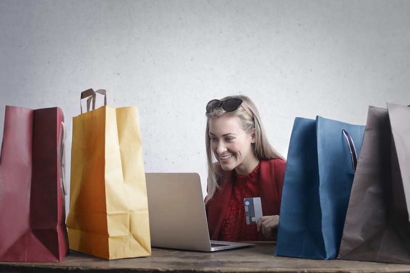 Happy woman shopping online