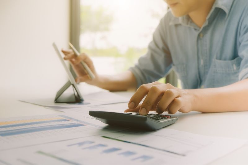 man using calculator