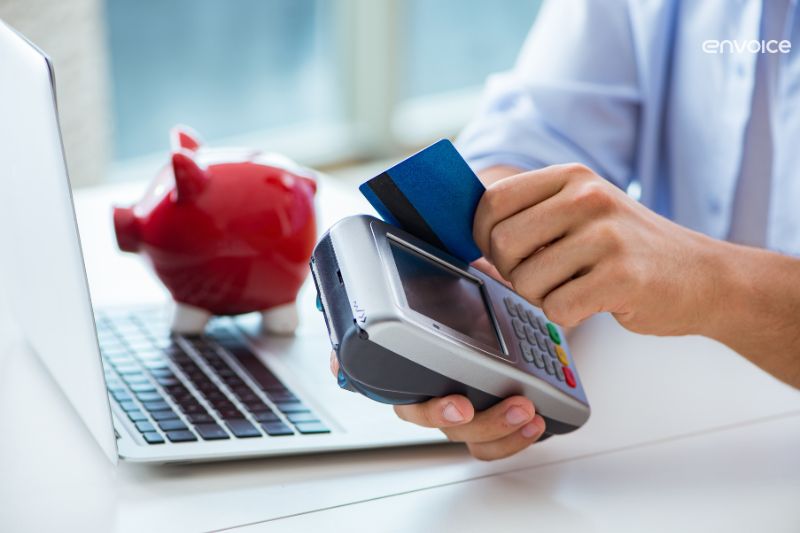 Business owner using a card reader for payment processing solutions.