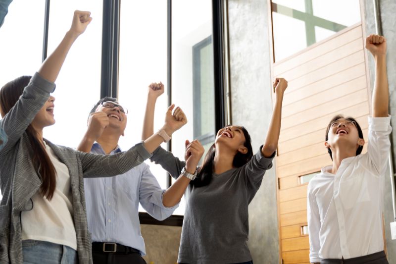 Office workers celebrating