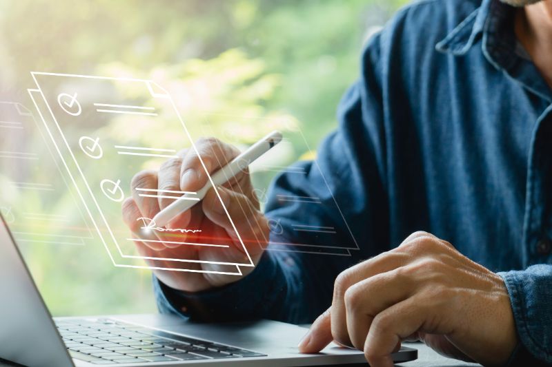 man signing in a digital document