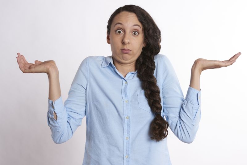 Business owner weaving the hands trying to choose between QBO or Xero