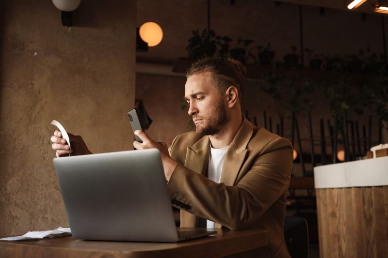 A person Scanning Receipts Using Your Smartphone’s Camera