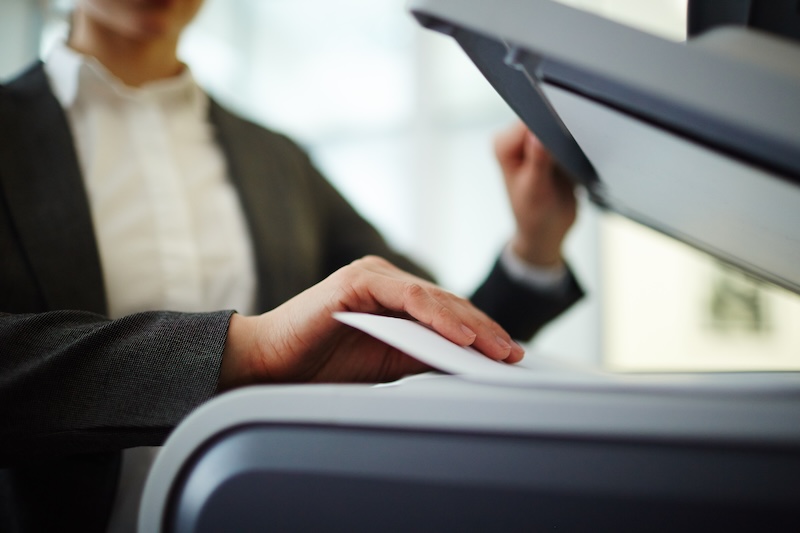 A business expert scanning Receipts on a printer using Desktop