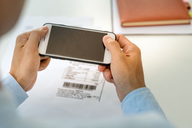 A person Scanning Receipts With a Receipt Scanner App