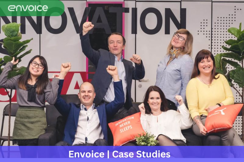 Cheerful team of six celebrating in a collaborative, innovative office, embodying the spirit of AI-driven bookkeeping for small businesses.