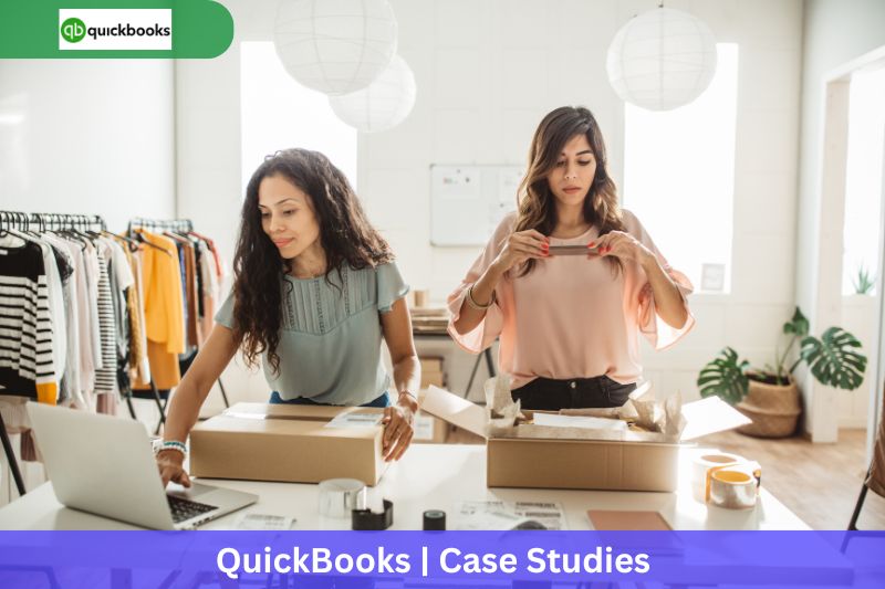 Two women packing boxes in a bright, modern workspace, with one using a laptop, symbolizing small business operations supported by AI bookkeeping