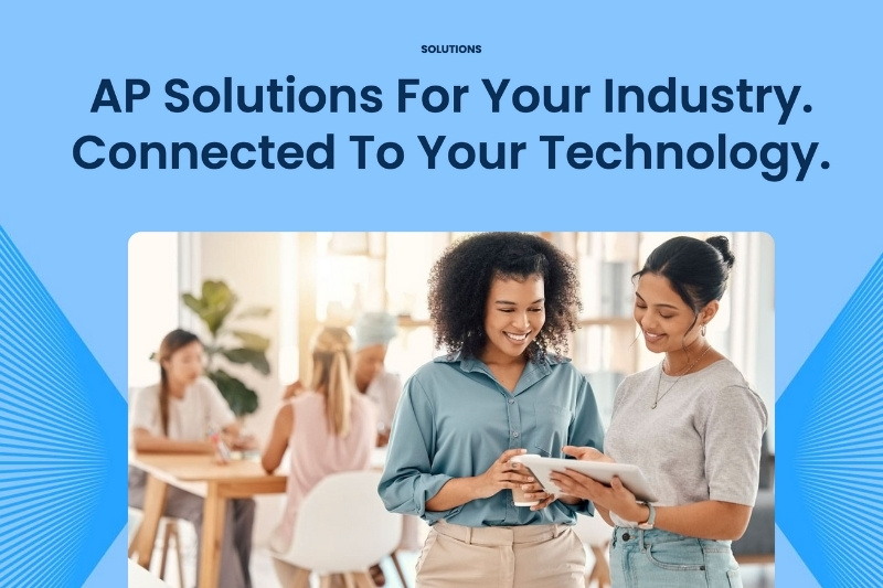 Two professionals collaborating on a tablet in a modern office, representing teamwork and technology-driven accounts payable solutions.