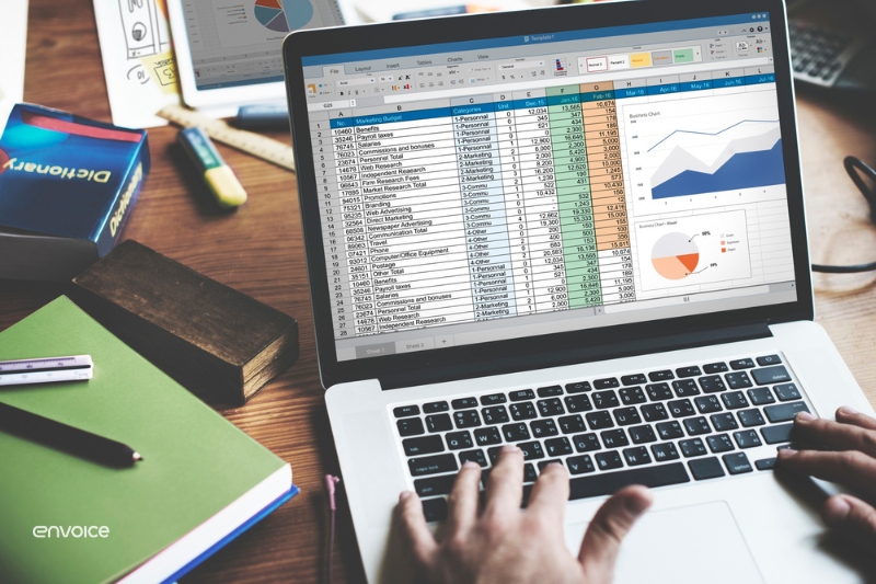 A person analyzing financial data on a laptop, highlighting the importance of software for efficient accounts receivable management