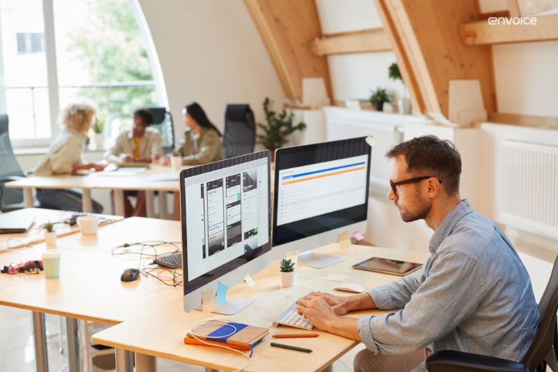 Professional analysing tools on dual monitors—visualising how to choose the right accounting software for your business
